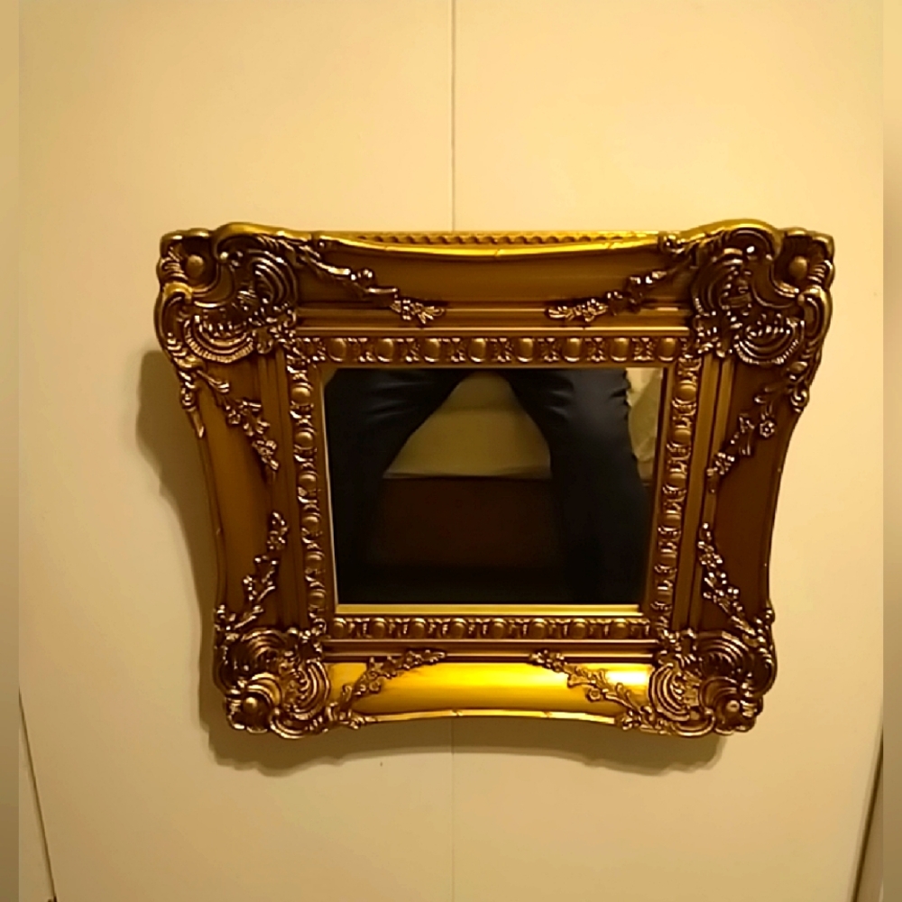 Mirror  with classic frame . Size is 17x15 "